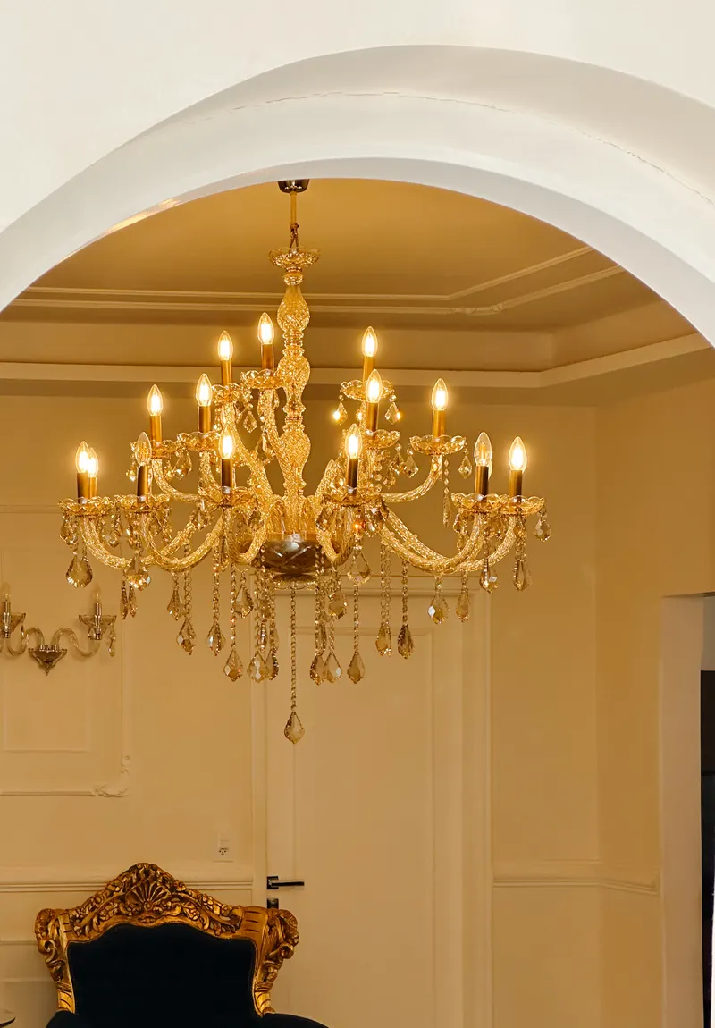A chandelier in a panelled reception hall