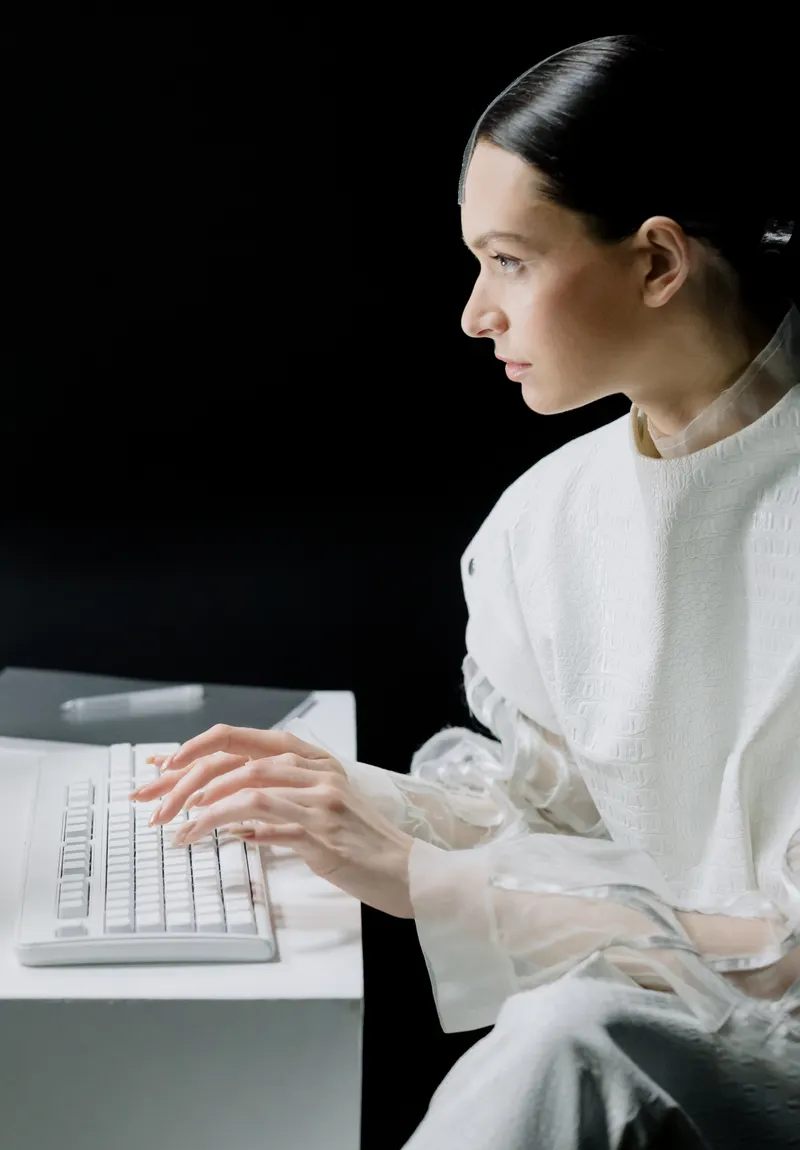 A professional working at a desk in profile